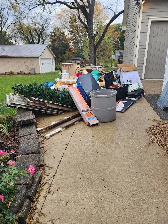 Dumpster being loaded with debris for 3 Yard Dumpster Rental in Dryden